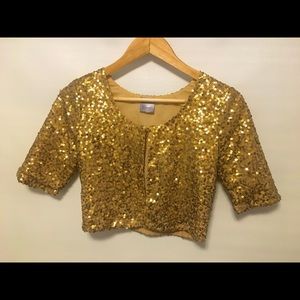Fun gold sequinned cropped bed jacket.
